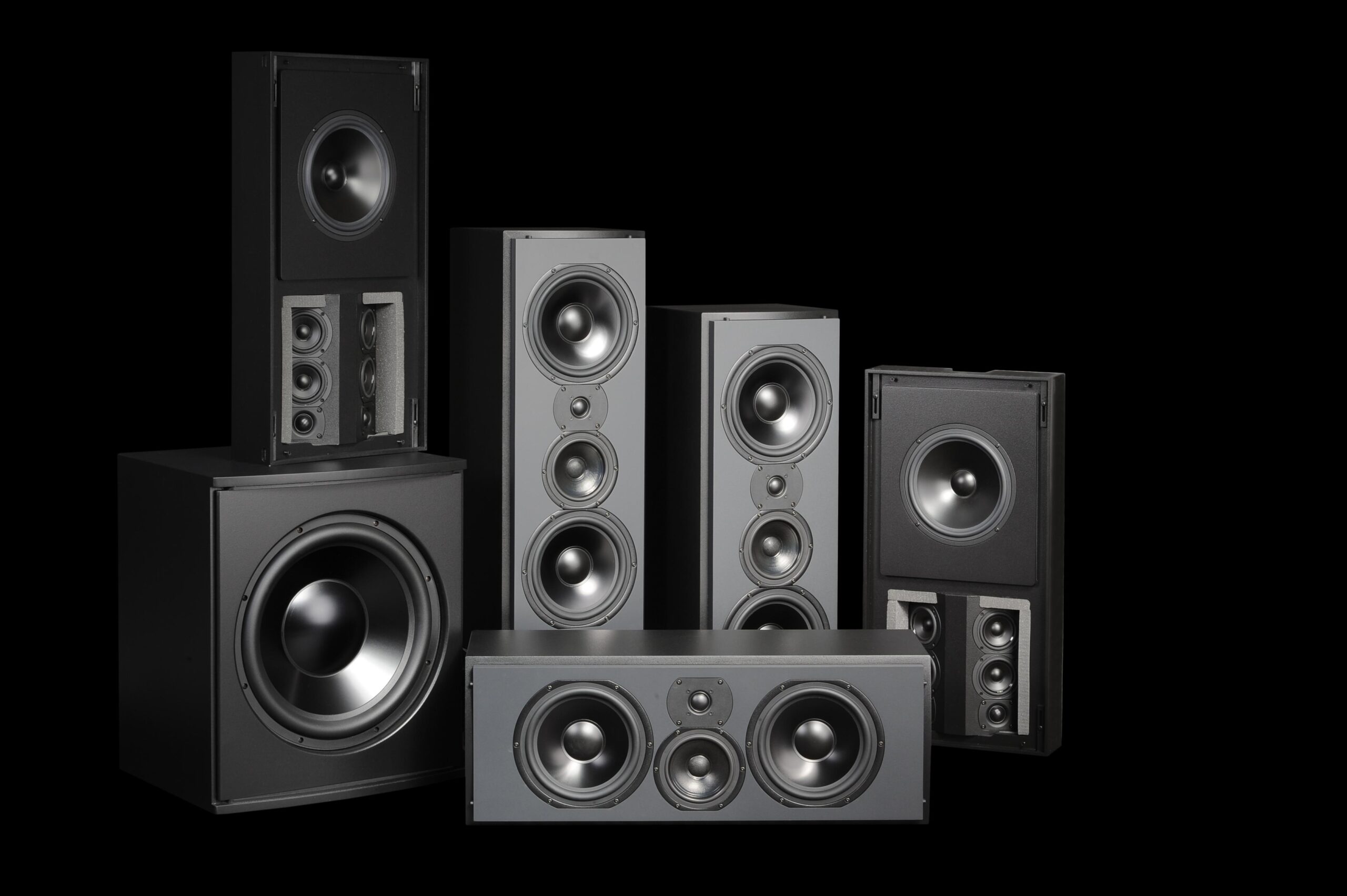 A surround sound speaker collection including center channel, left and right channel, and subwoofers.